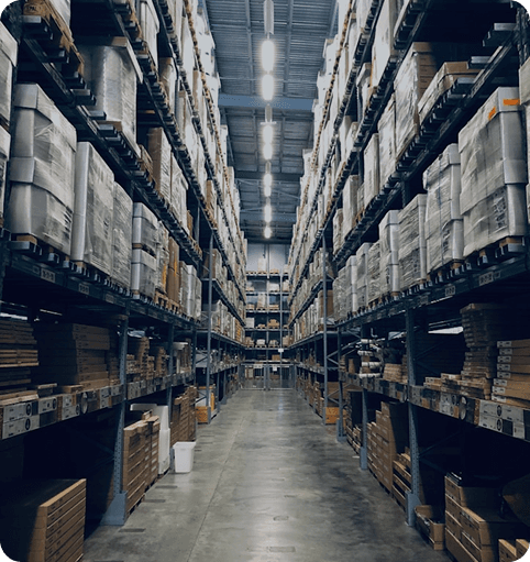 Warehouse aisle with stacked inventory shelves
